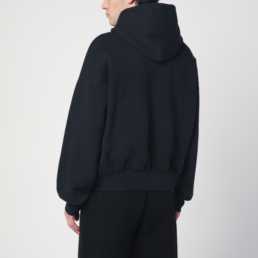 Fear of God Essentials Black hoodie with University logo