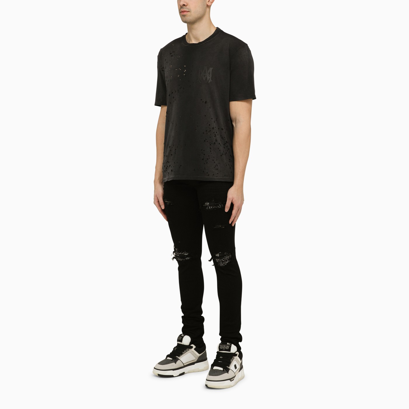 AMIRI Black skinny jeans with camouflage patches | TheDoubleF