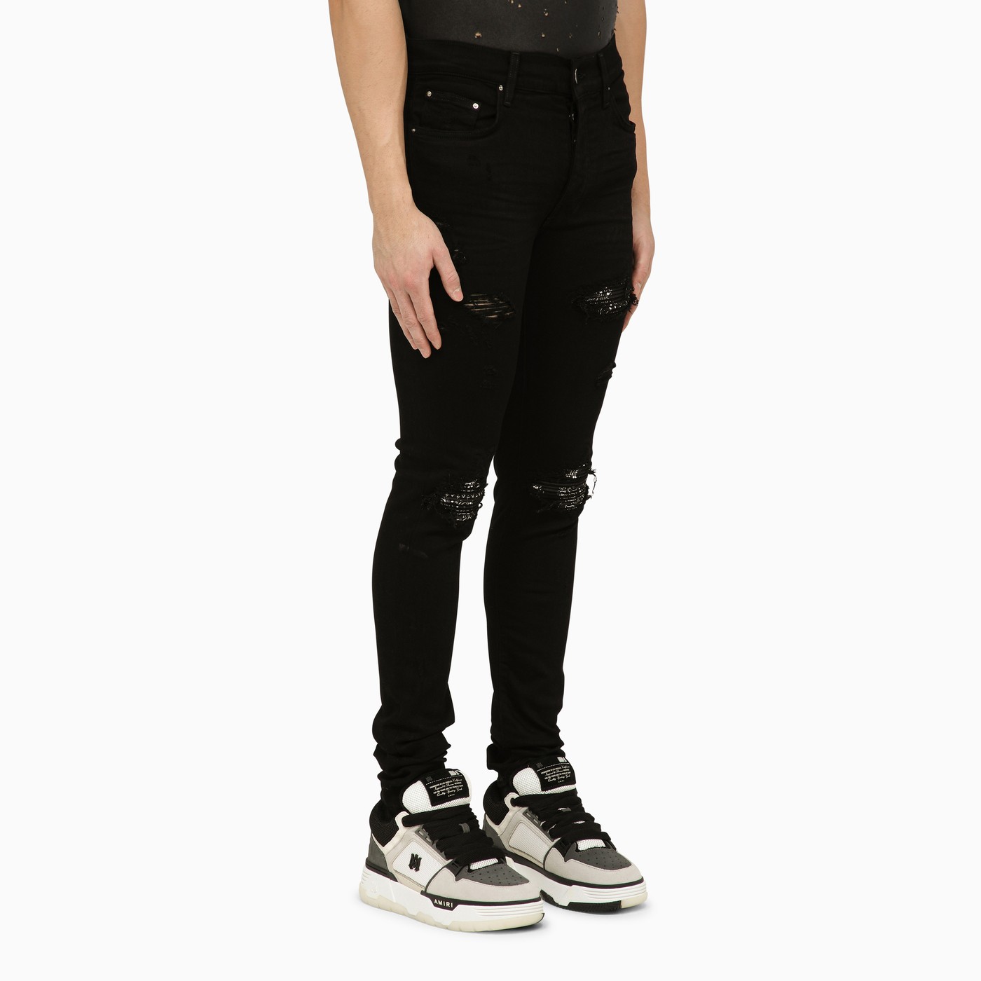 AMIRI Black skinny jeans with camouflage patches | TheDoubleF