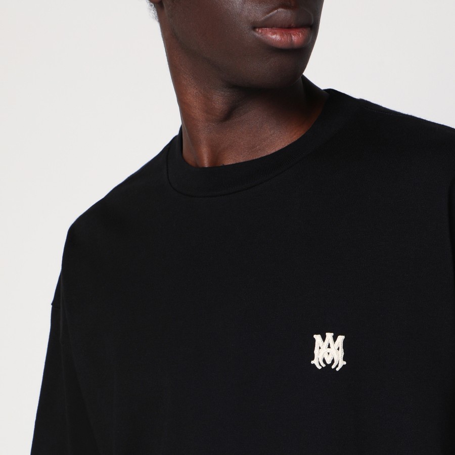 Tシャツ・カットソー AMIRI BLACK COTTON T-SHIRT WITH LOGO PATCH AMIRI Black cotton T-shirt with logo patch | TheDoubleF