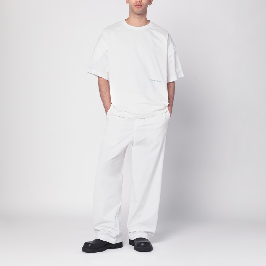 Tシャツ・カットソー OAMC Men T Shirts PCM1OT06AJE003002 WHT WHITE OAMC Peacemaker oversized white T-shirt | TheDoubleF