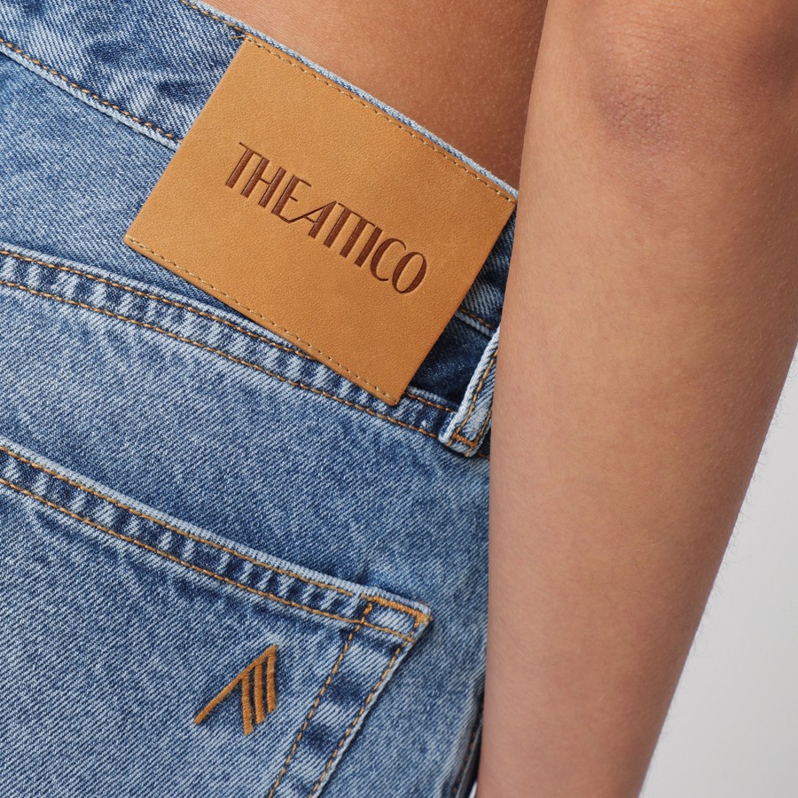 The Attico Sky blue jeans with long leg curled at the hem