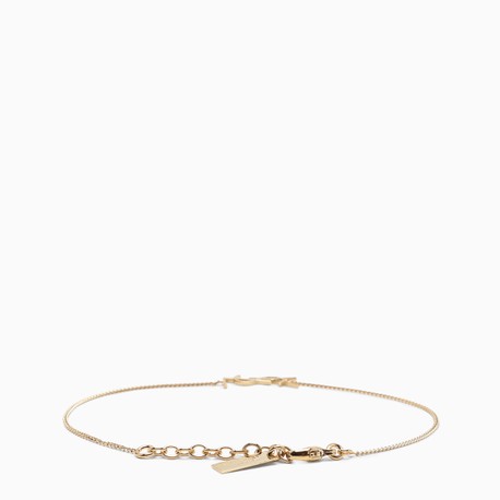 saint laurent charm bracelet in gold brass