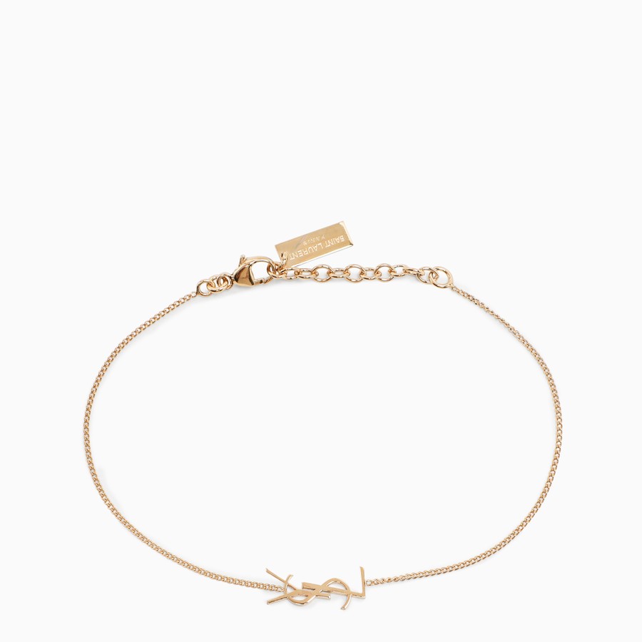 saint laurent charm bracelet in gold brass