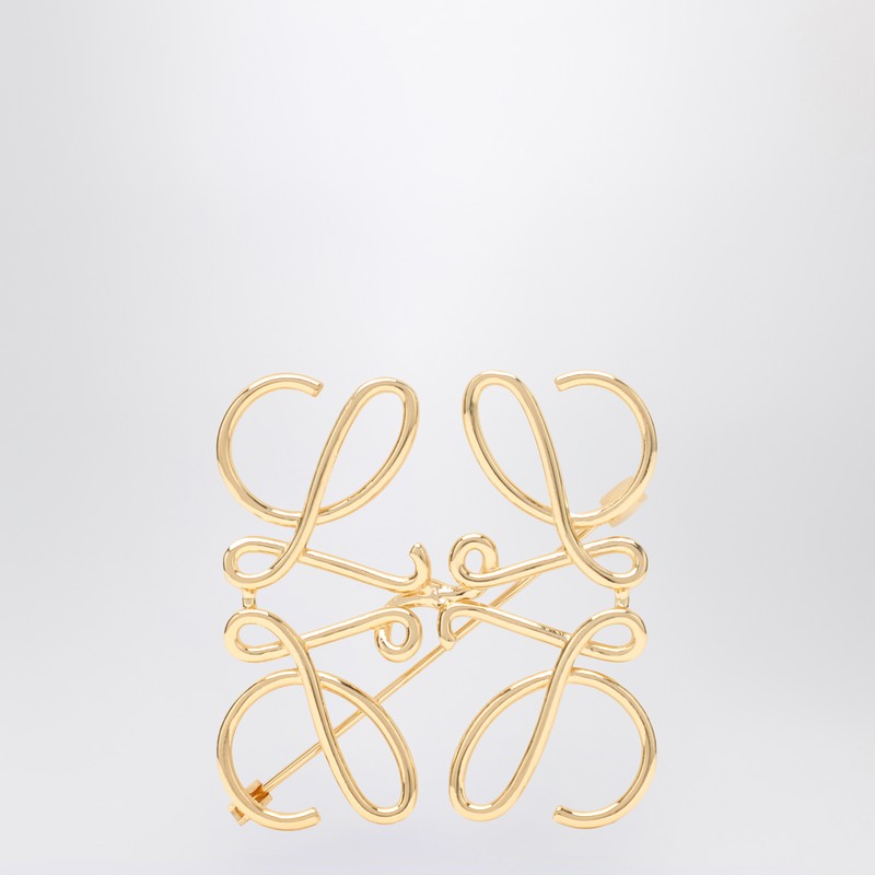 Anagram brooch in gold metal