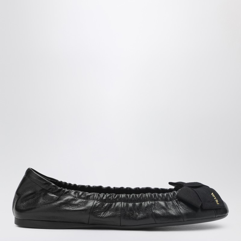 Black patent leather ballet flats with bow