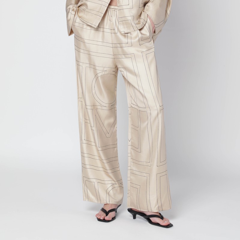 Ivory silk trousers with monogram