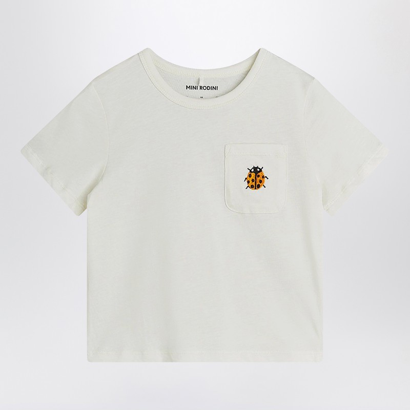 white T-shirt with ladybug embroidery