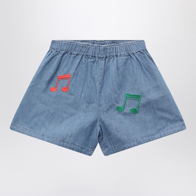 Light blue denim shorts with musical notes