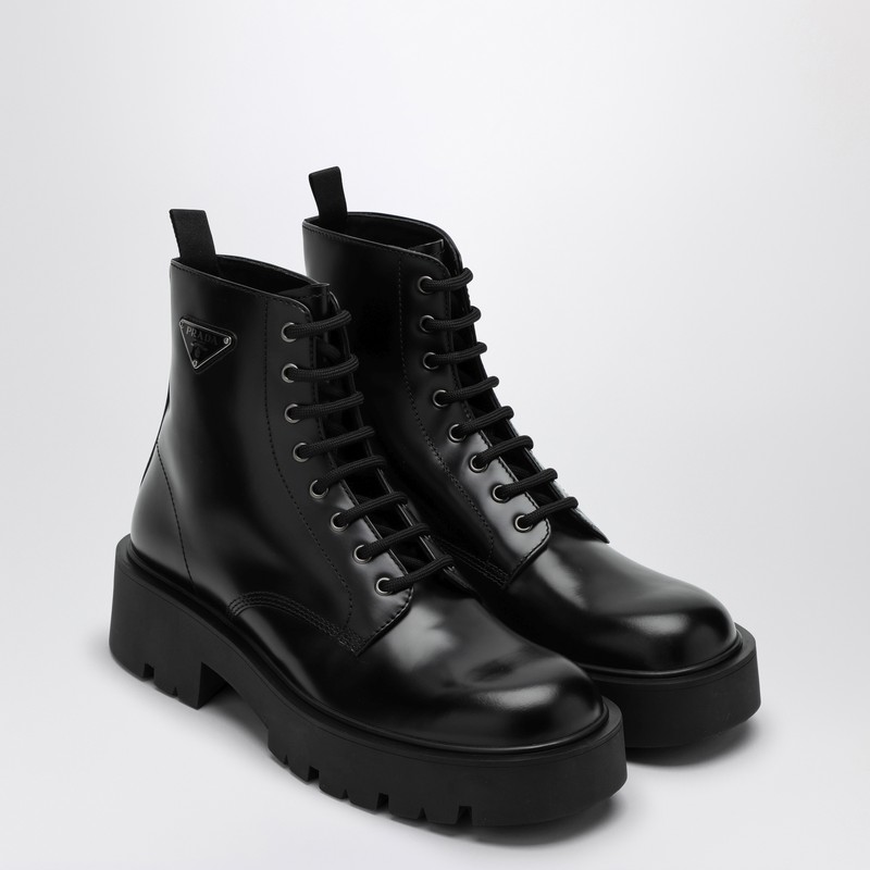 Prada Logo-plaque Panelled Ankle Boots In Black