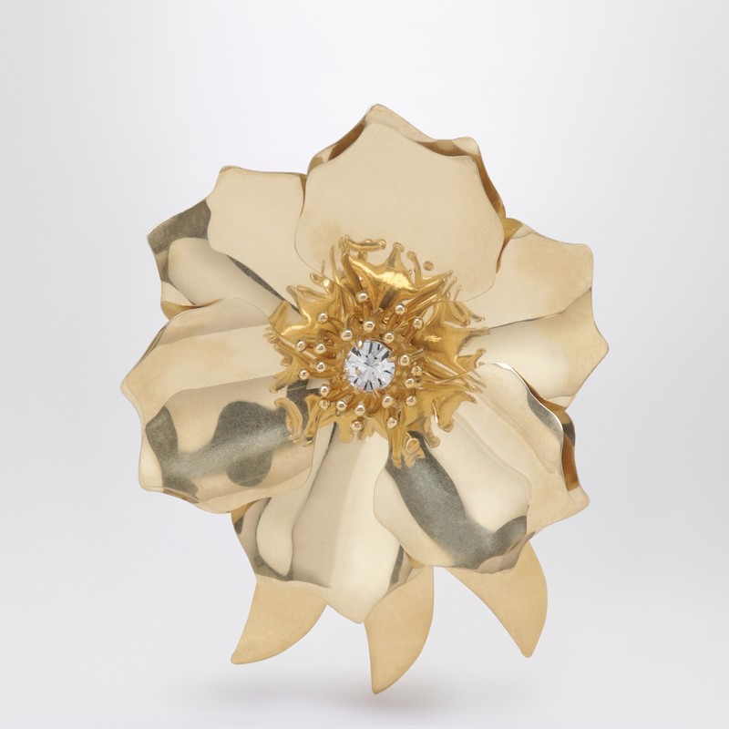 Gold-tone metal brooch with crystal