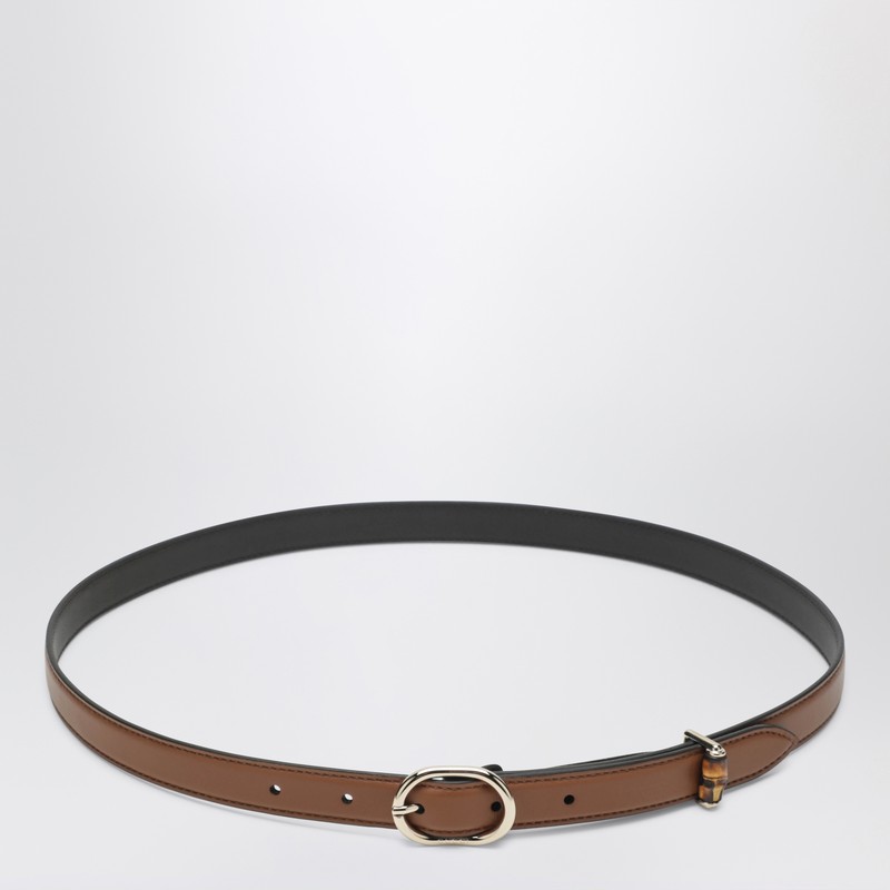 Thin brown belt with oval buckle