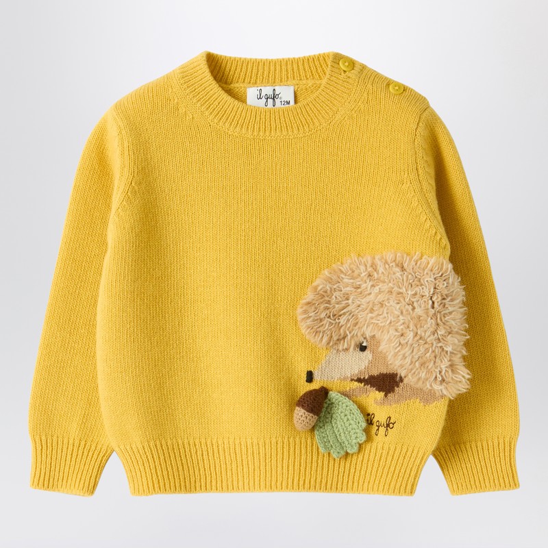 Yellow wool sweater with curly texture