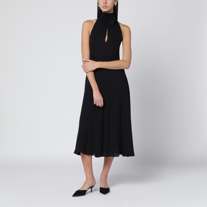 Black flared dress with flower