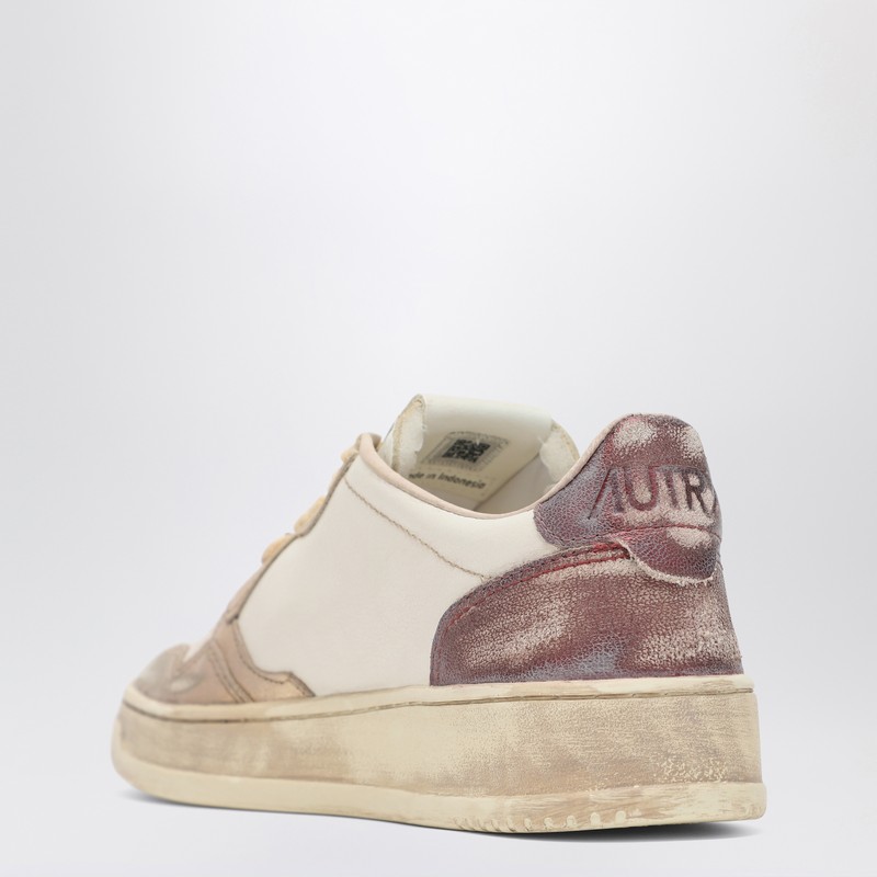 Autry Super Vintage Distressed Paneled Metallic Leather Sneakers In Pink