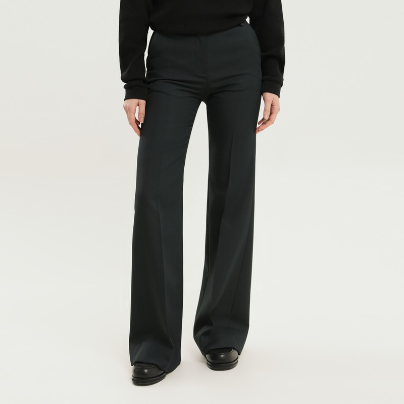 High-waisted dark green bell-bottom pants