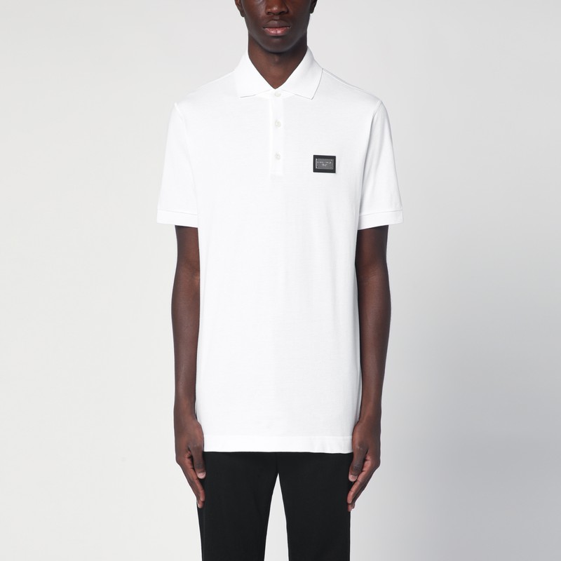 White polo with logo plaque