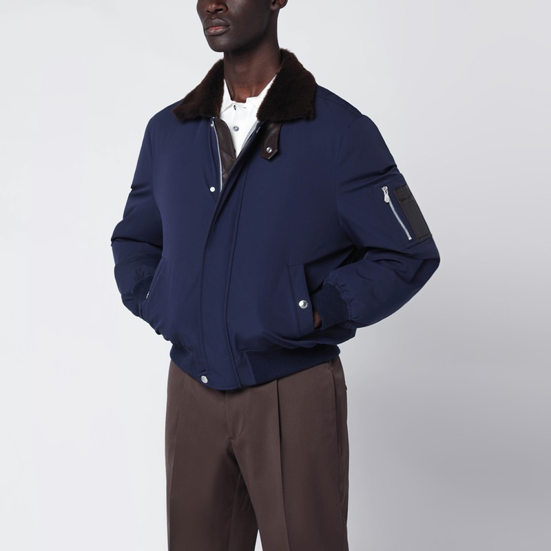 Indigo nylon puffer jacket with shearling collar