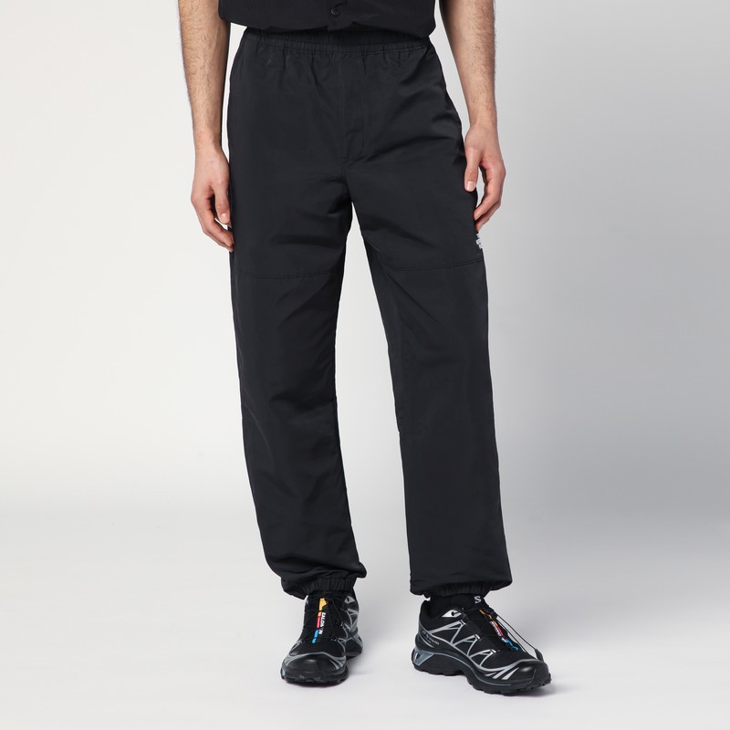 Black trousers in technical fabric with logo