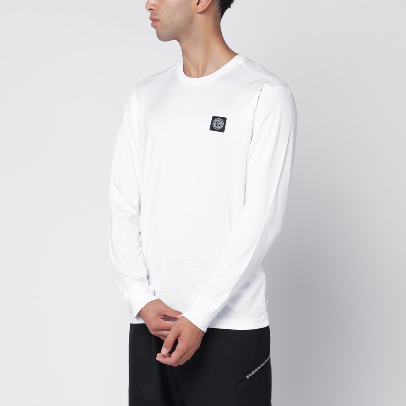 White sweater with Compass logo patch