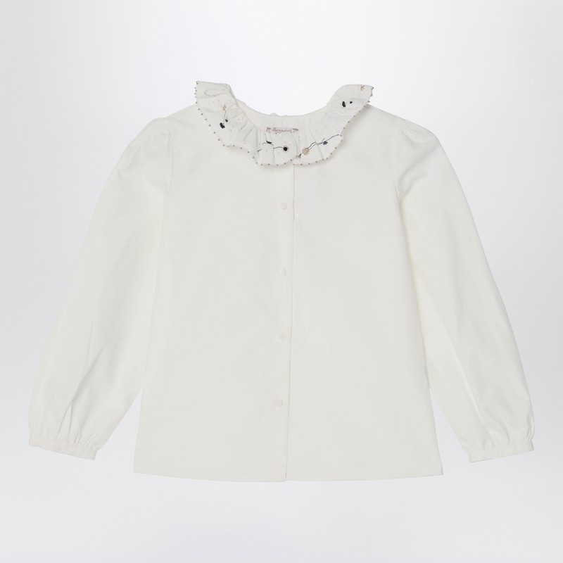 White ruffled blouse